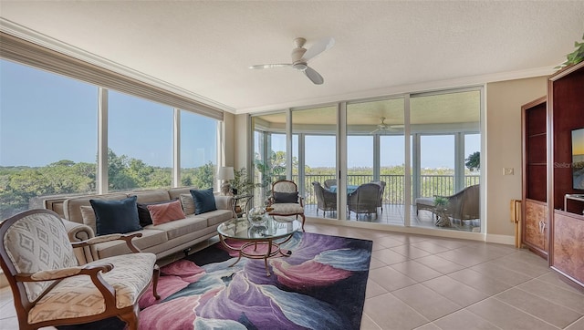 sunroom featuring ceiling fan