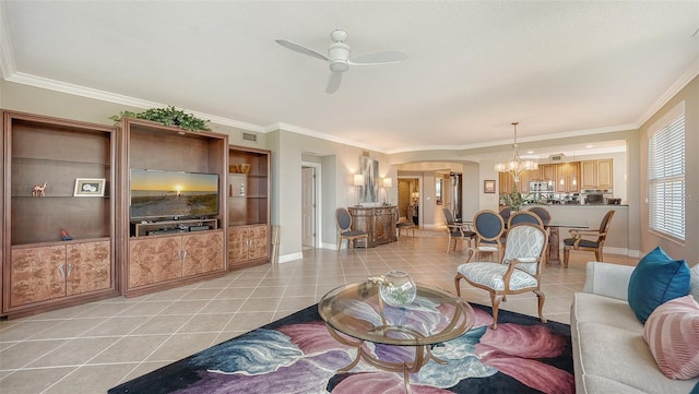 living room featuring ceiling fan with notable chandelier, ornamental molding, and light tile patterned floors