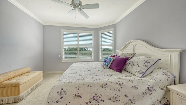 bedroom featuring ornamental molding, ceiling fan, and light carpet