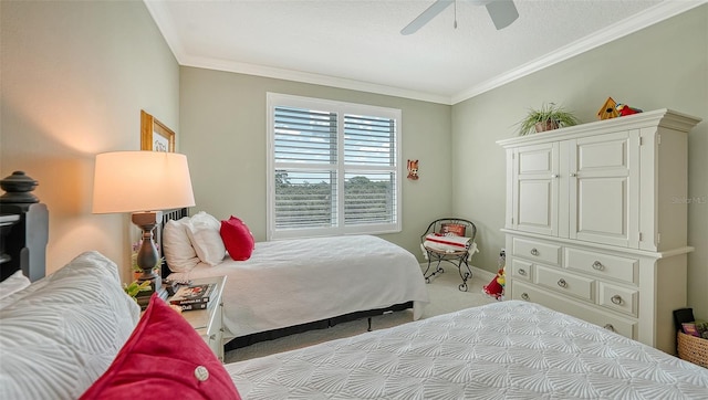 bedroom featuring ceiling fan, ornamental molding, and light carpet