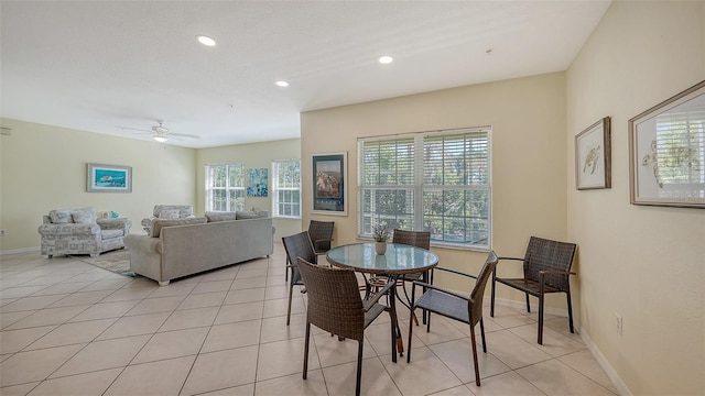 tiled dining area featuring a wealth of natural light and ceiling fan