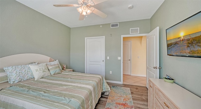 bedroom featuring ceiling fan and light hardwood / wood-style flooring