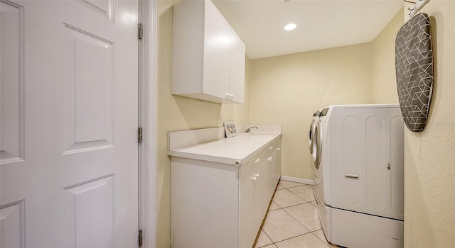 laundry room with sink, separate washer and dryer, cabinets, and light tile floors