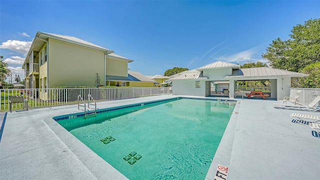 view of pool with a patio and a gazebo