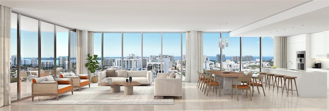 living room featuring floor to ceiling windows, a water view, and plenty of natural light