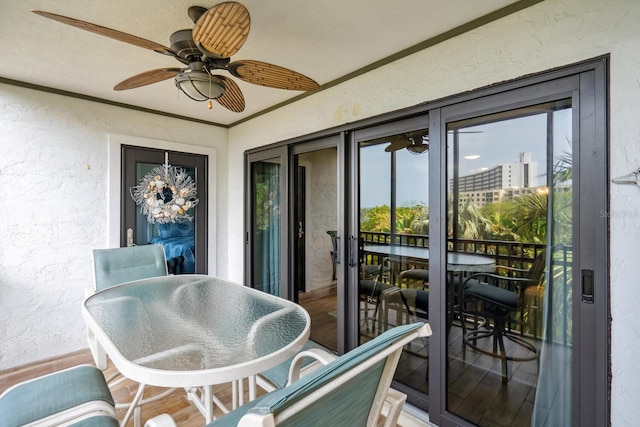 sunroom featuring ceiling fan