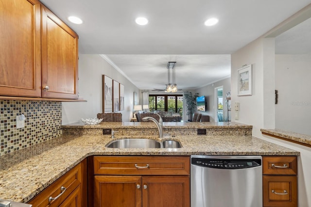 kitchen with kitchen peninsula, sink, ornamental molding, and dishwasher