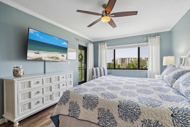 bedroom featuring access to outside, ornamental molding, dark wood-type flooring, and ceiling fan