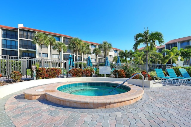 view of swimming pool featuring a community hot tub