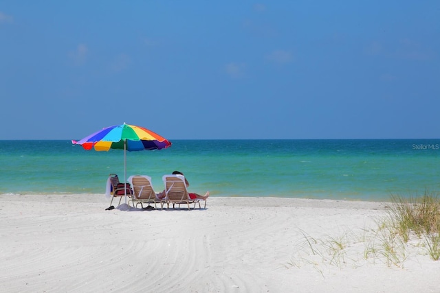 property view of water featuring a beach view