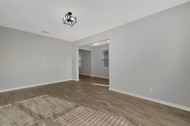 empty room with hardwood / wood-style floors