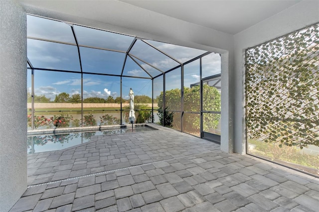 view of patio / terrace featuring a lanai