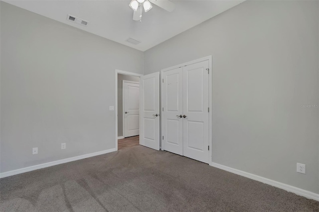 unfurnished bedroom featuring ceiling fan, carpet flooring, and a closet