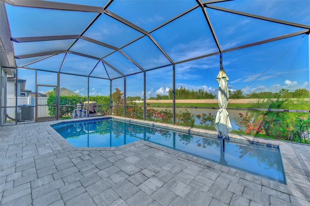 view of pool featuring a lanai, central AC, and a patio area