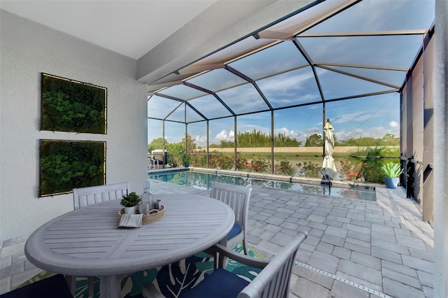 view of patio featuring a lanai