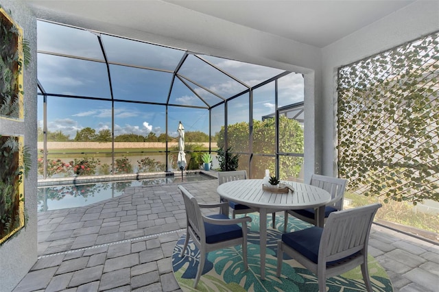 view of patio / terrace featuring glass enclosure