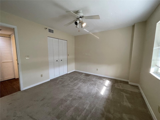 unfurnished bedroom featuring a closet, carpet, and ceiling fan