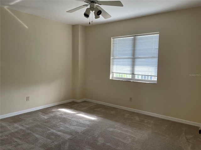 unfurnished room with ceiling fan and carpet floors