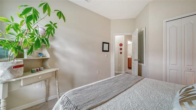 carpeted bedroom with a closet