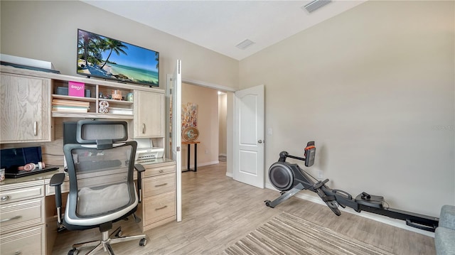 office space with light hardwood / wood-style flooring