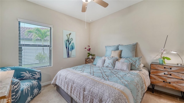 bedroom featuring ceiling fan and light colored carpet