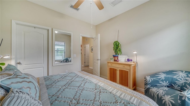 bedroom featuring ceiling fan, light wood-type flooring, and a closet