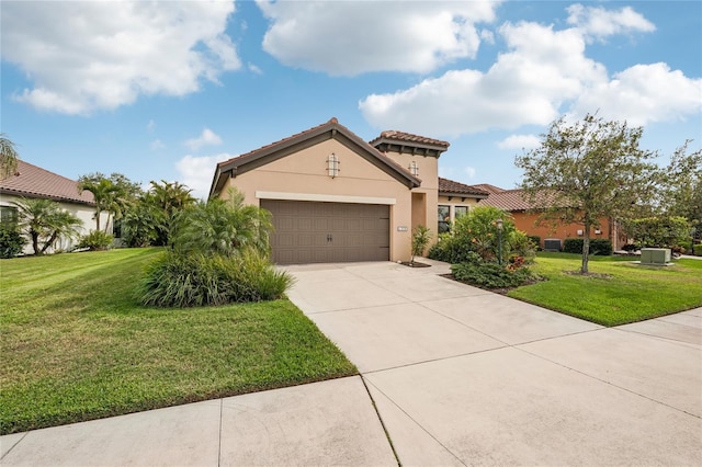 mediterranean / spanish-style home with a garage and a front lawn