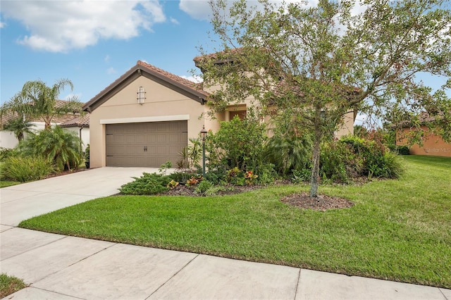 view of front of house with a front yard and a garage