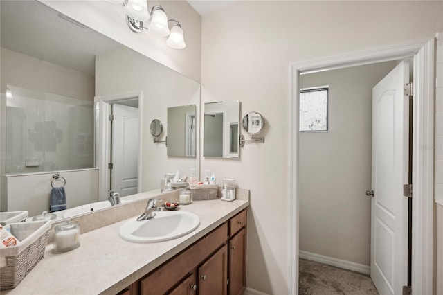 bathroom with vanity and walk in shower