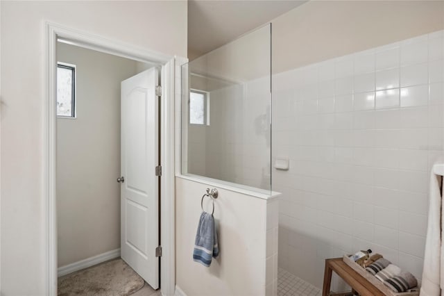 bathroom featuring a tile shower