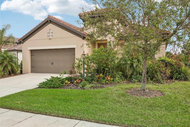 view of front of property with a front lawn and a garage