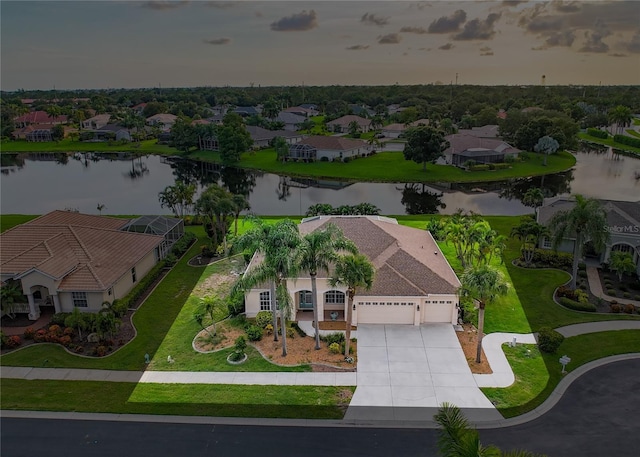 bird's eye view featuring a water view and a residential view