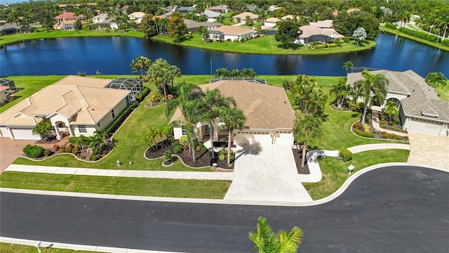 birds eye view of property with a water view and a residential view