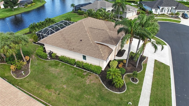 birds eye view of property featuring a water view and a residential view