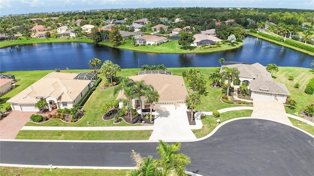 drone / aerial view featuring a water view and a residential view