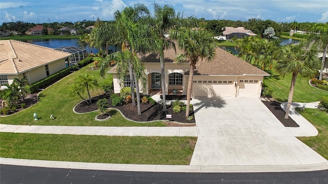 mediterranean / spanish house featuring an attached garage, a lanai, a water view, concrete driveway, and a front lawn