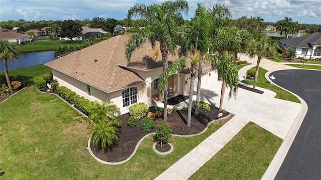 aerial view with a water view and a residential view