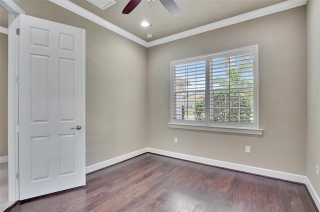 spare room featuring ornamental molding, dark hardwood / wood-style floors, and ceiling fan