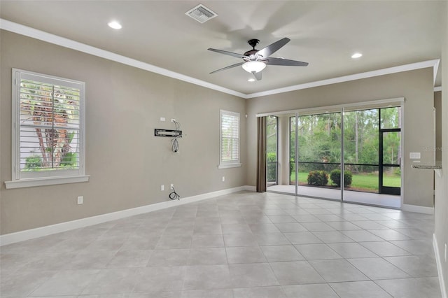 tiled empty room featuring ornamental molding and ceiling fan