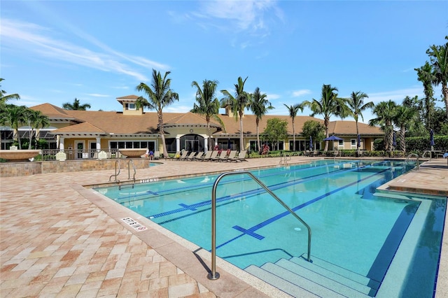 view of swimming pool featuring a patio area