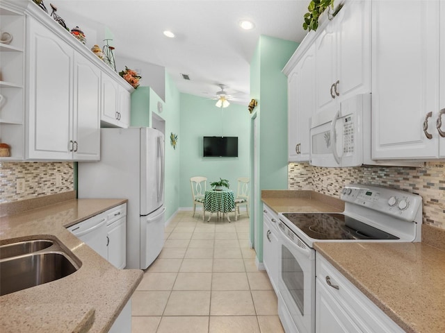 kitchen featuring white cabinetry, ceiling fan, backsplash, white appliances, and light tile patterned flooring