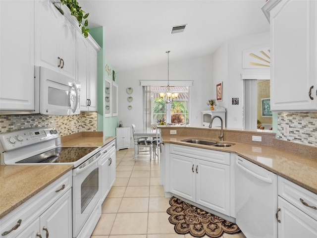 kitchen with sink, a chandelier, lofted ceiling, white appliances, and white cabinets