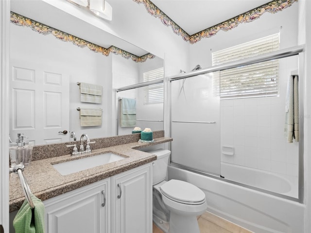 full bathroom with tile patterned floors, vanity, toilet, and enclosed tub / shower combo