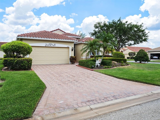 mediterranean / spanish-style home featuring a garage and a front lawn