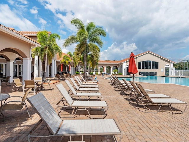 view of swimming pool with a patio area