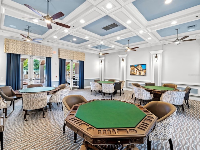 recreation room with french doors, beamed ceiling, light colored carpet, and coffered ceiling