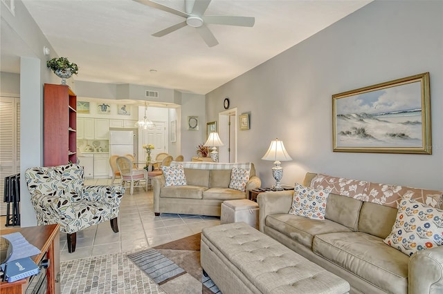 living room featuring ceiling fan and light tile patterned floors