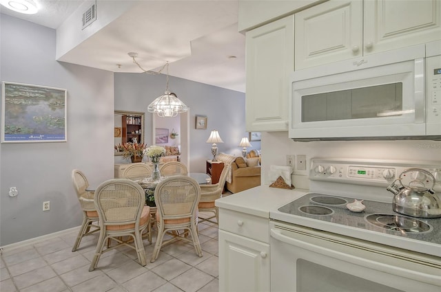 dining area featuring light tile patterned floors