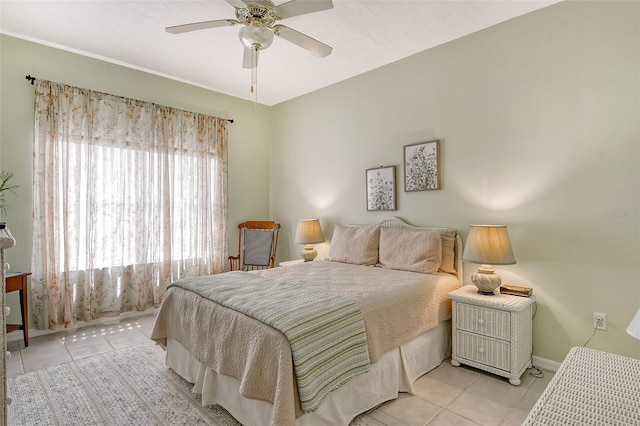 bedroom featuring ceiling fan and light tile patterned flooring