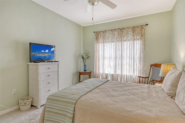 bedroom with light tile patterned floors and ceiling fan